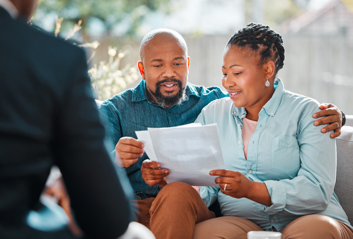 A couple talking with a pension advisor